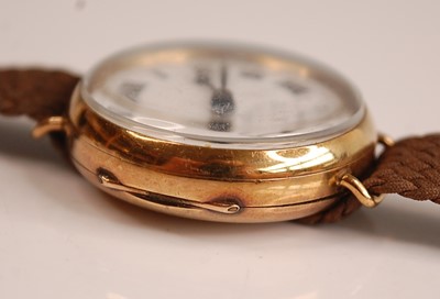 Lot 1167 - A 9ct yellow gold manual wind trench watch,...