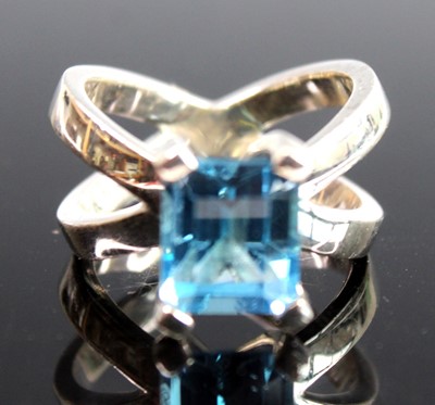 Lot 2522 - A white metal blue topaz dress ring, featuring...