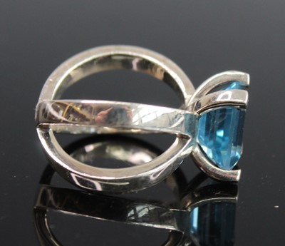 Lot 2522 - A white metal blue topaz dress ring, featuring...