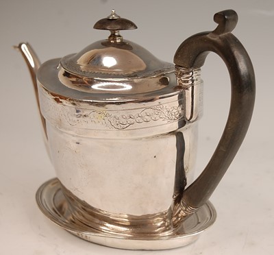 Lot 1037 - A George III silver teapot and stand, the...