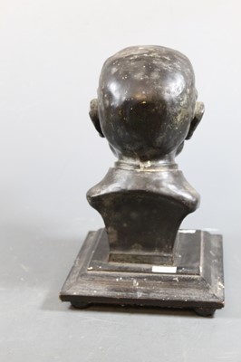 Lot 43 - An early 20th century black composition...