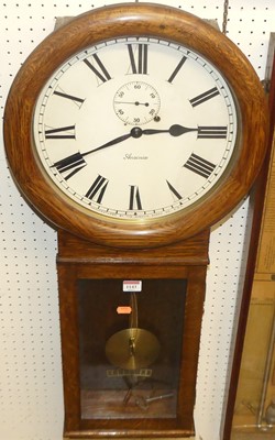 Lot 1143 - An Ansonia Company oak droptrunk wall clock,...