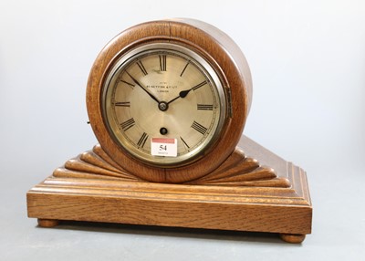 Lot 54 - An early 20th century oak cased mantel clock,...
