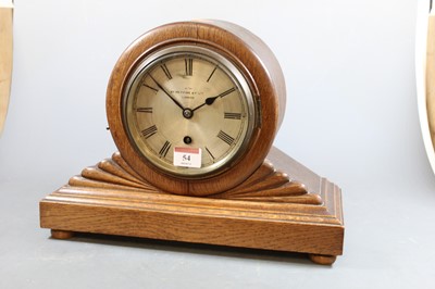 Lot 54 - An early 20th century oak cased mantel clock,...