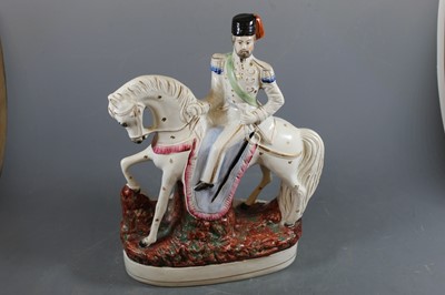 Lot 57 - A pair of Victorian Staffordshire models of...