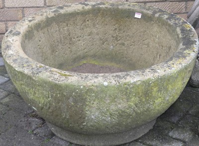 Lot 1149 - A large carved sandstone circular footed font,...