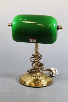 Lot 59 - A lacquered brass desk lamp having adjustable...