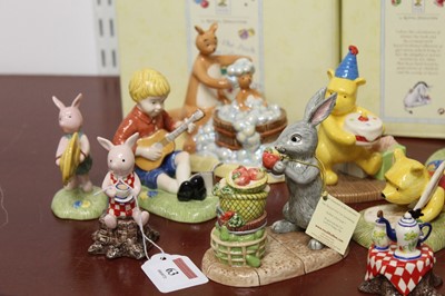 Lot 63 - A collection of 20 Winnie The Pooh figures, to...