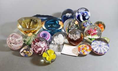 Lot 84 - A collection of glass paperweights to include...