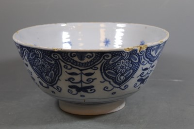 Lot 100 - A 17th century English Delft bowl, the...