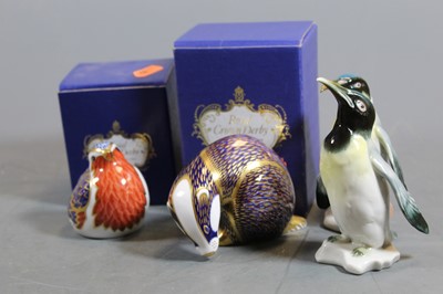 Lot 242 - A Royal Crown Derby porcelain model of a robin,...