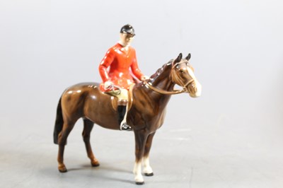 Lot 244 - A Beswick figure of The Huntsman, in standing...