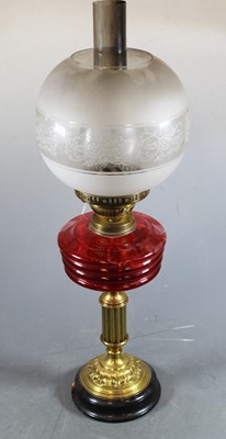 Lot 143 - An early 20th century brass pedestal oil lamp...
