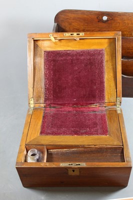 Lot 147 - A Victorian walnut writing slope, the hinged...