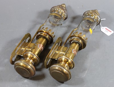 Lot 151 - A pair of early 20th century brass belware...