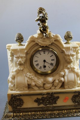 Lot 153 - An early 20th century carved alabaster mantel...