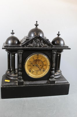 Lot 184 - A late Victorian black slate mantel clock of...