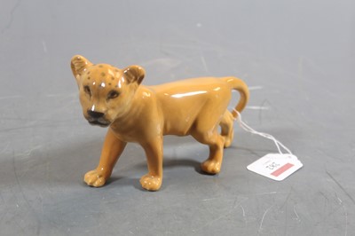 Lot 282 - A Beswick model of a lion cub facing left,...