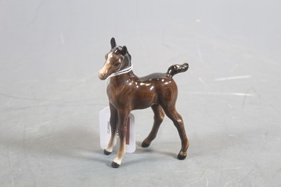 Lot 288 - A Beswick model of a foal, brown gloss model...