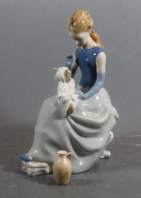 Lot 300 - A Royal Dux porcelain figure of a seated lady...