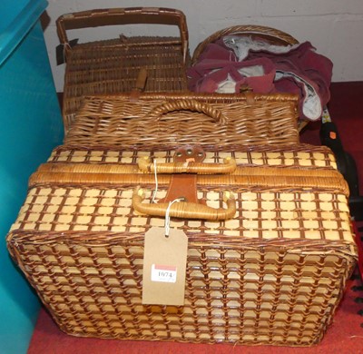 Lot 1074 - A wicker hamper, two others, basket and curtains