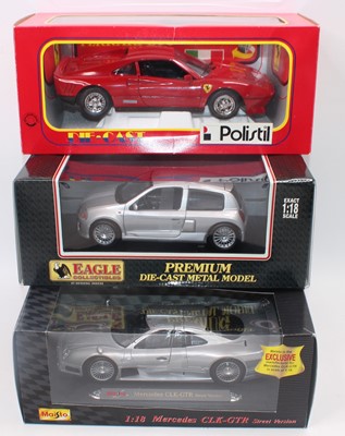 Lot 2114 - A 1/18 scale boxed  diecast vehicle group,...