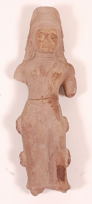 Lot 291 - * A red sandstone figure of a deity in...