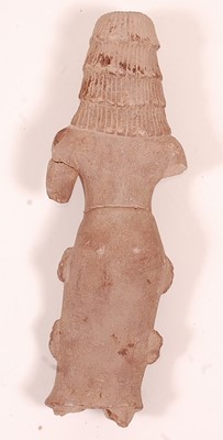 Lot 131 - A red sandstone figure of a deity in standing...