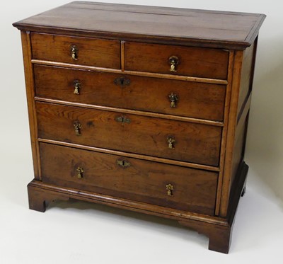 Lot 1346 - An early 18th century oak chest, of two short...