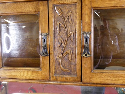 Lot 380 - A circa 1900 Art Nouveau oak mirrorback...