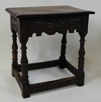Lot 1349 - An early 18th century oak joint stool, the one-...