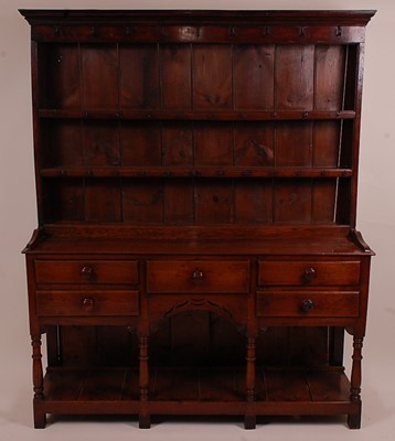 Lot 1374 - An 18th century oak dresser, the upper section...