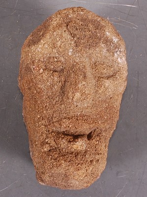 Lot 422 - * A weathered sandstone head, carved as a...