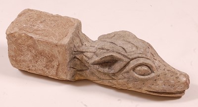 Lot 2441 - A limestone gargoyle, carved as a dragons head,...