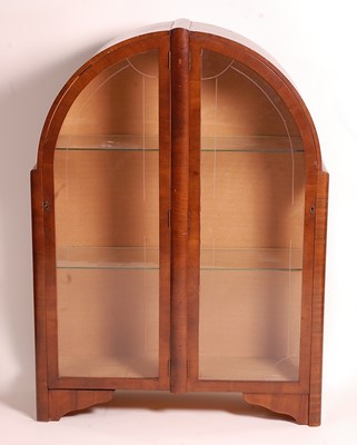 Lot 392 - An Art Deco figured walnut dome topped double...