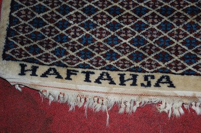 Lot 1366 - A Persian woollen cream ground Bokhara rug,...