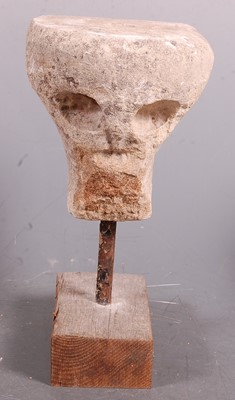 Lot 426 - * A limestone carving in the form of a skull,...