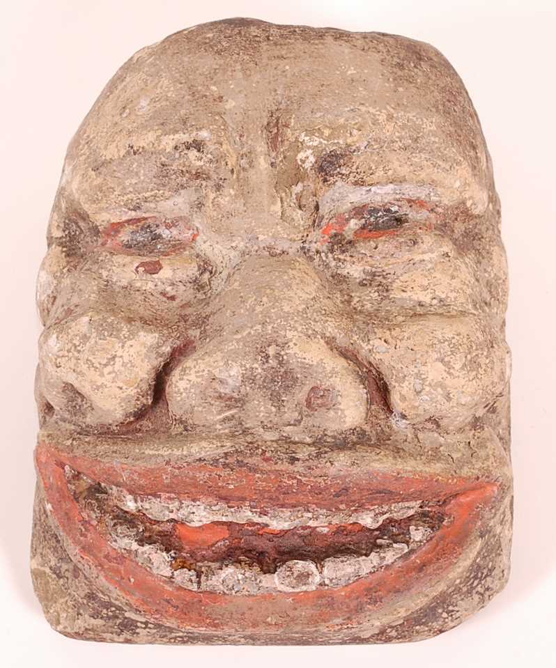 Lot 53 - A limestone head, carved as a male face with...