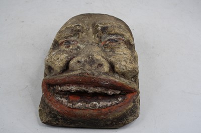 Lot 53 - A limestone head, carved as a male face with...