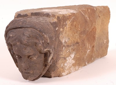 Lot 431 - * A limestone figurative arch support, carved...