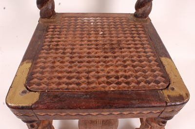 Lot 140 - * A prestige chair, carved from indigenous...