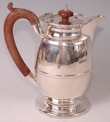 Lot 1048 - A George V silver hot water pot, of plain...