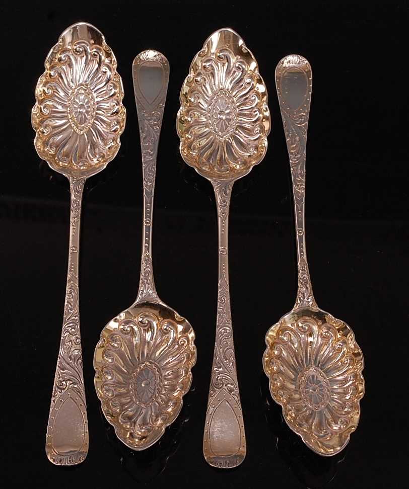 Lot 1051 - A matched set of four George III silver berry...
