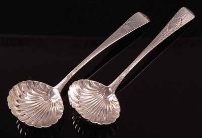 Lot 1052 - A pair of George IV Irish silver sauce ladles,...