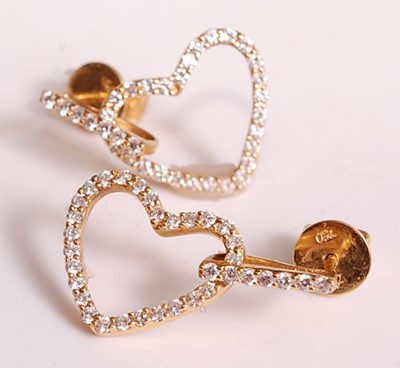 Lot 1104 - A pair of yellow metal diamond set open heart...