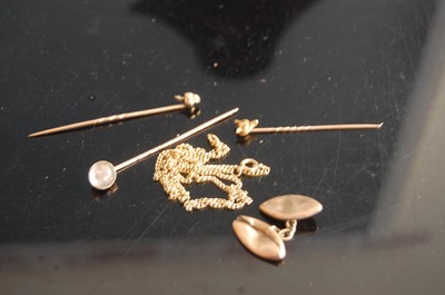 Lot 324 - A yellow metal and moonstone set tie-pin;...