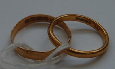 Lot 326 - Two 22ct gold wedding bands, 6g, sizes P and T...