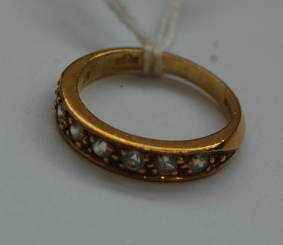 Lot 331 - An 18ct gold white sapphire set half eternity...