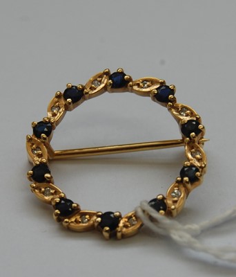 Lot 333 - A contemporary 9ct gold, blue and white...