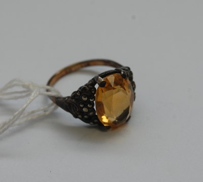 Lot 336 - A 9ct gold and silver citrine set dress ring;...